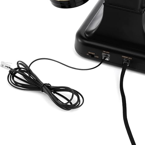Vintage black and gold landline phone with adjustable ringer volume and button dialing for home or o.
