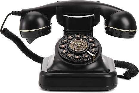 Vintage black and gold landline phone with rotary dial and adjustable ringer volume.